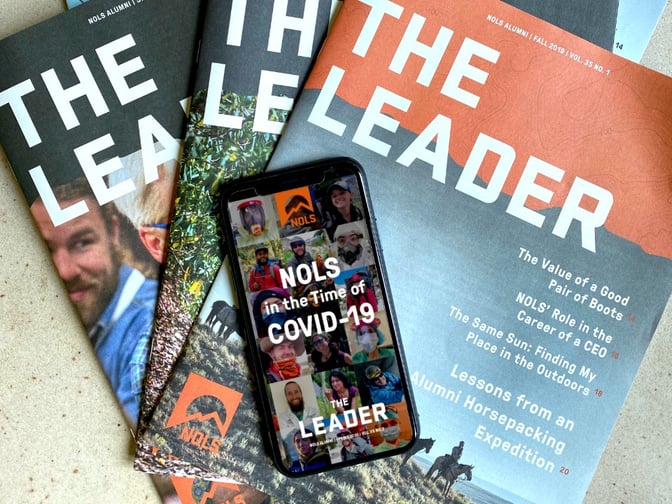 Phone with the spring 2020 Leader cover and print editions