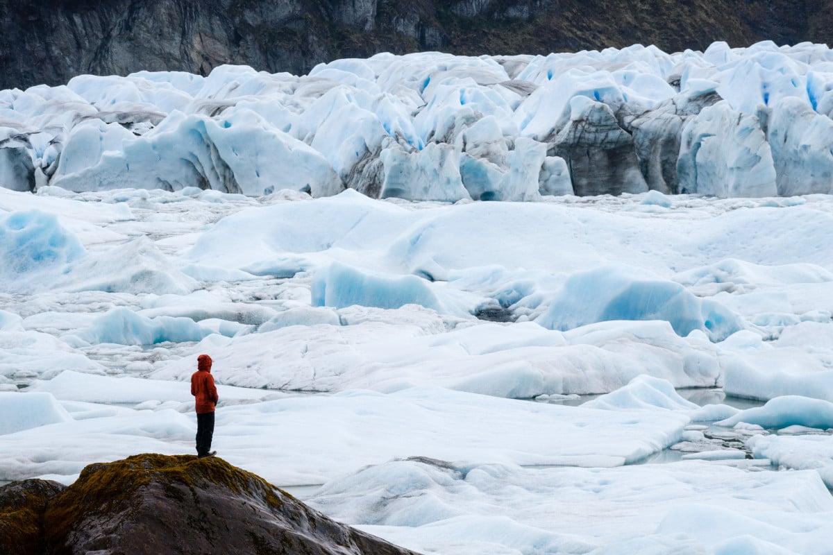 Lone individual observes an intricate glacier field