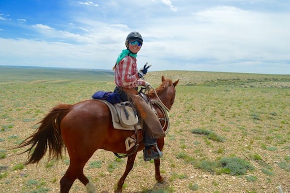 NOLS student on horseback wearing cotton during her horsepacking course