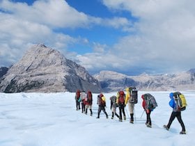 NOLS students use crampons to backpack across snowfield in Patagonia