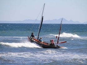 NOLS students navigate a surf-filled landing in a Drascombe Longboat in Baja California