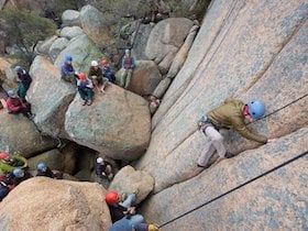 NOLS students partake in a lesson on crack climbing in the Southwest