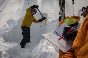 NOLS students on a winter course test snow and analyze snowpack to determine avalanche risk on a slope