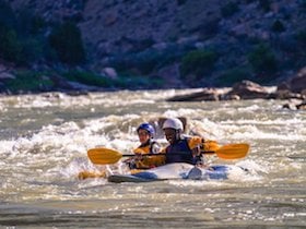 NOLS participants whitewater kayak in the Rockies