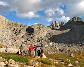 NOLS students circle up while backpacking in Wyoming's Wind River Range