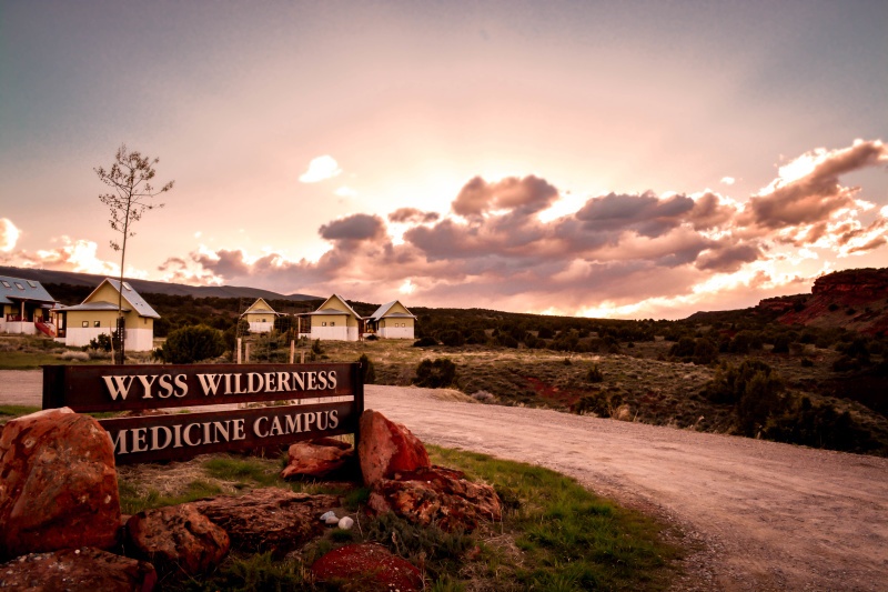 Photo of the housing and sign at the Wyss Wilderness Medicine Campus