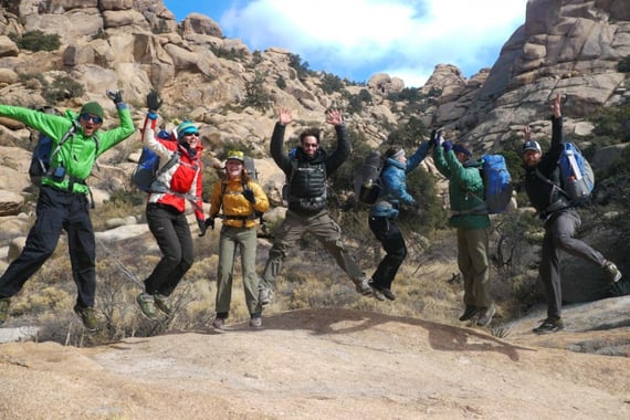 Hikers jump in unison