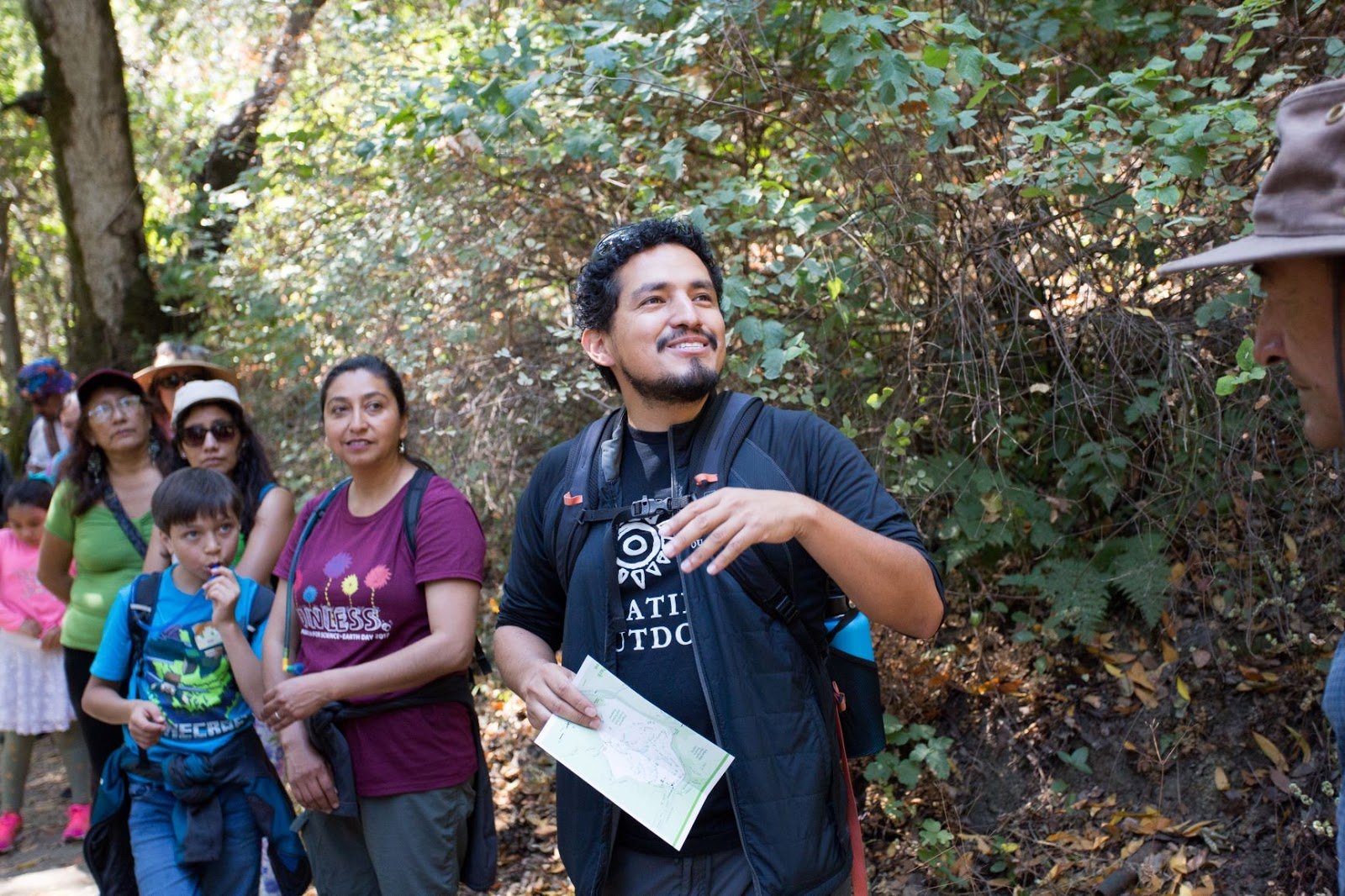 Photo of Jose Gonzalez leading a group on a hike for Latino Outdoors