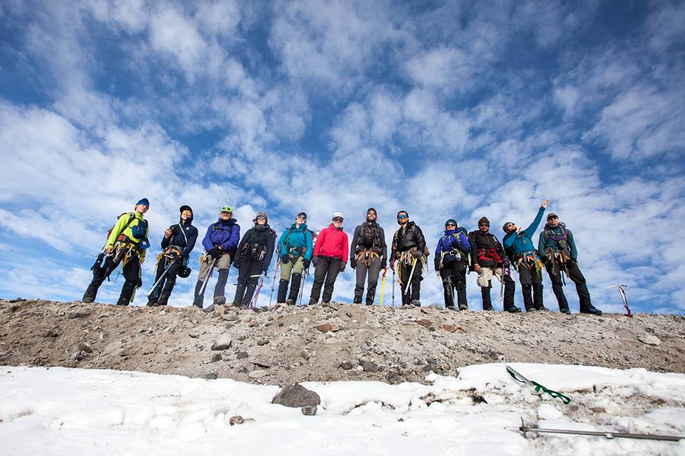 Group of NOLS students in a line wearing mountaineering gear