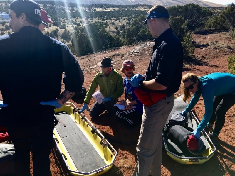 Wilderness Medicine students practice putting a patient in a litter.