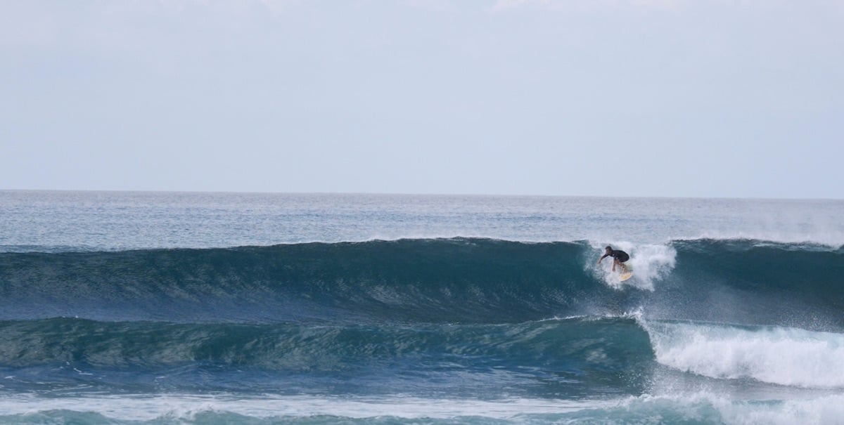 Surfer on waves in Baja California