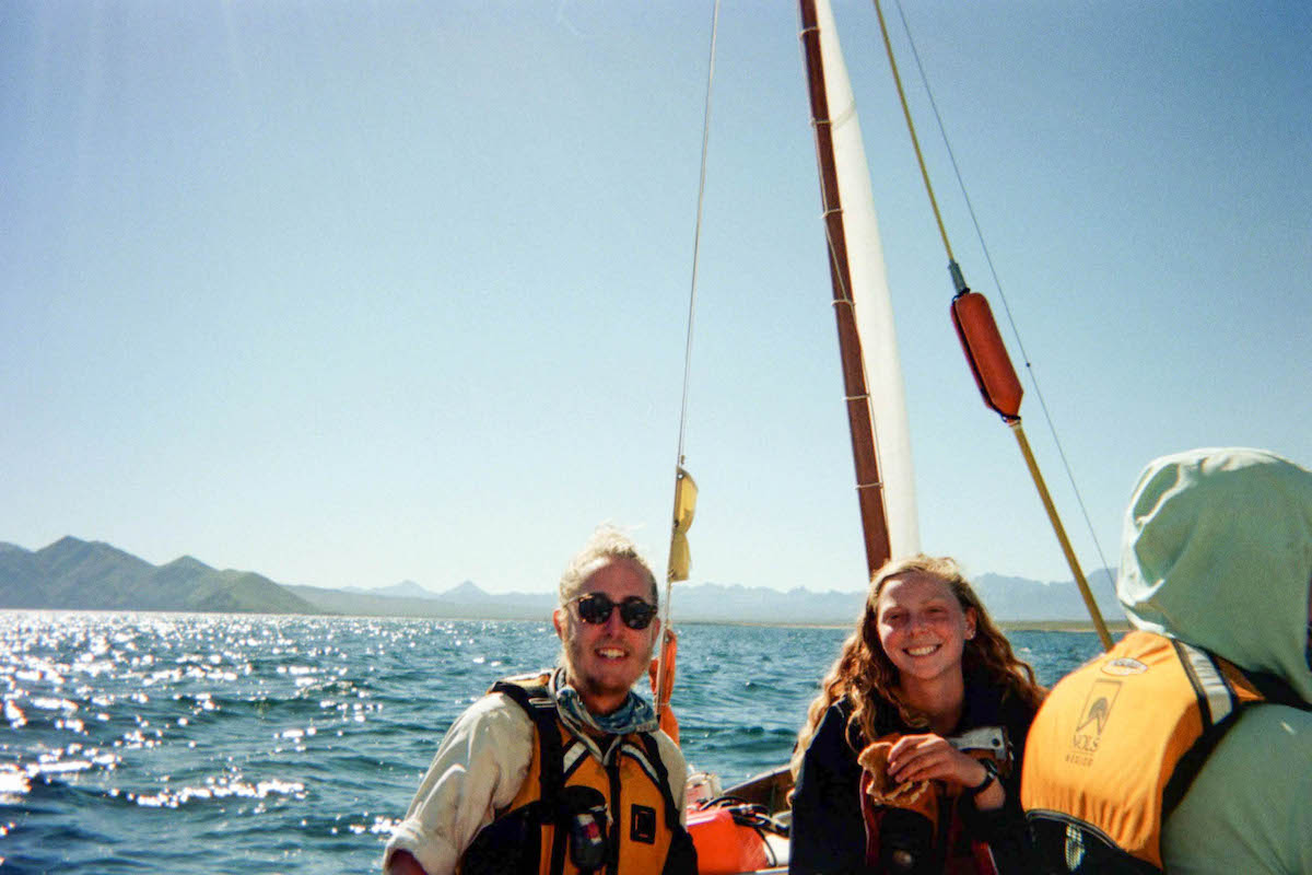 smiling NOLS students sailing in Mexico's Bay of Cortez