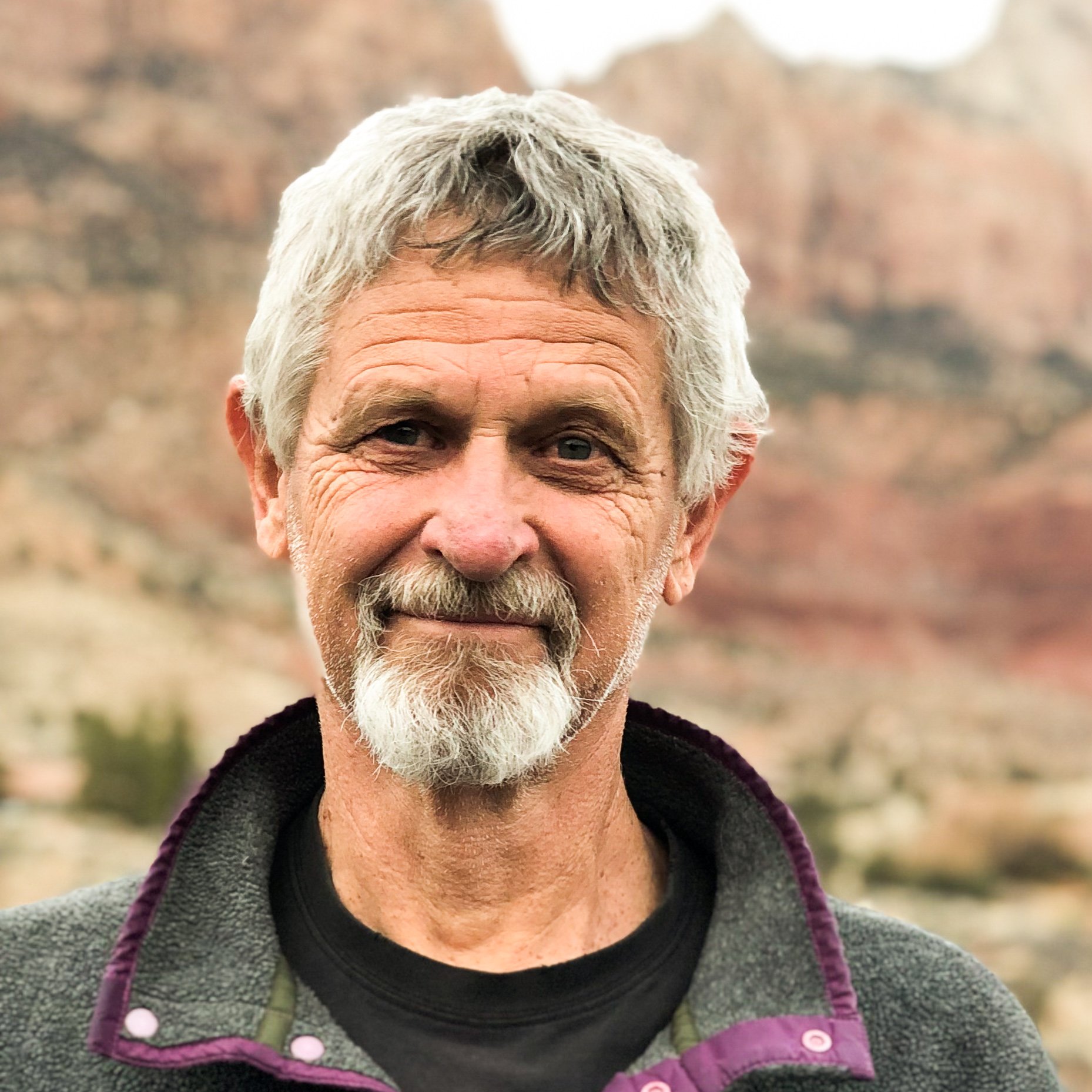 portrait of Randy Aton wearing a grey fleece