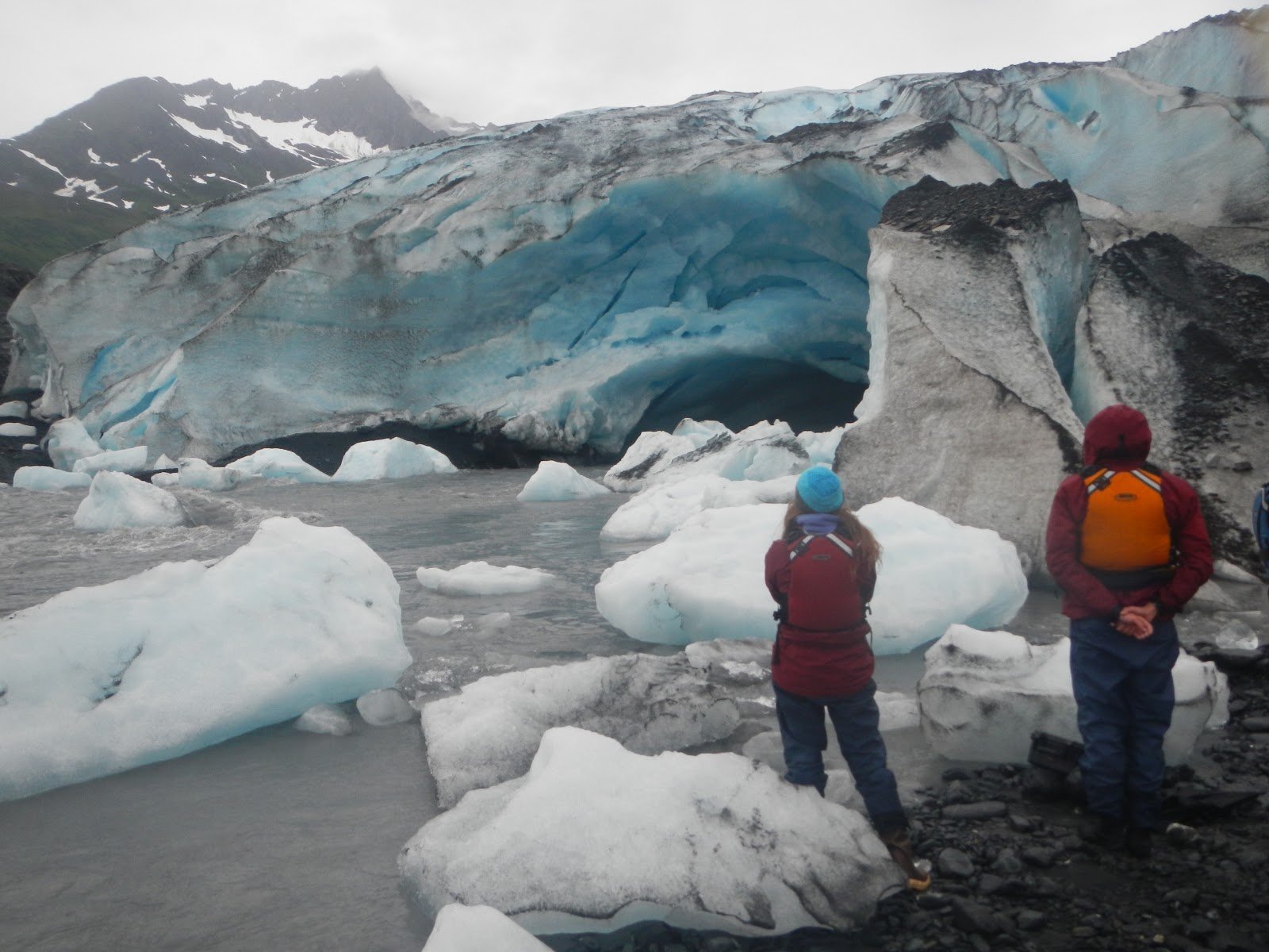 People looking at a glacier