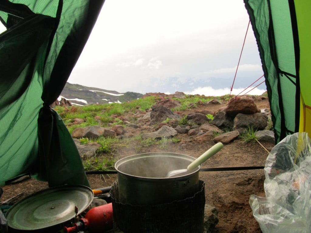 Steaming pot in the door of a tent