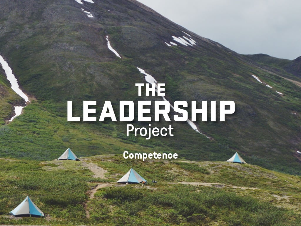 Text reading The Leadership Project: Competence overlays 4 pyramid shaped tents in a mountain meadow