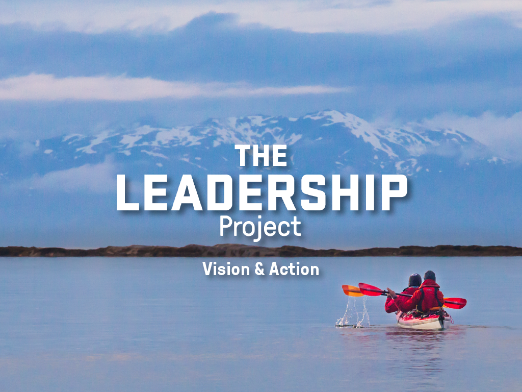 Text overlay of The Leadership Project: Vision & Action on an image of a tandem kayak with snowy mountains